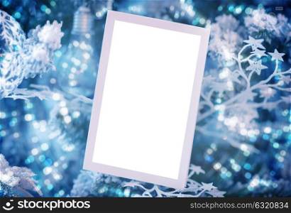 Blank white Christmas card on blue festive background, invitation for New Year party, beautiful winter time decoration
