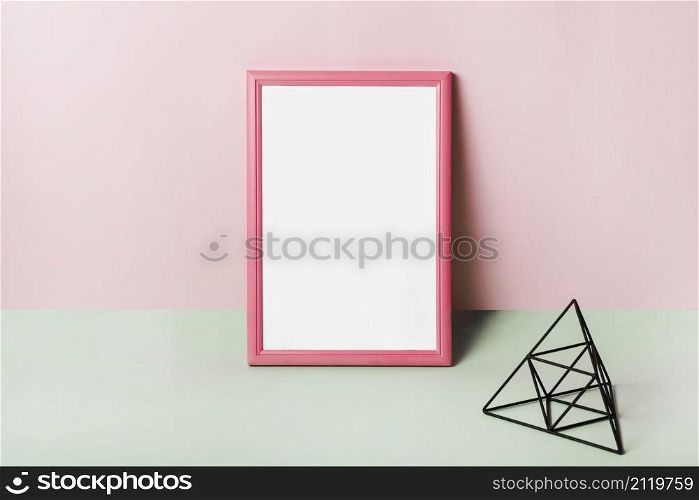 blank white frame with pink border against pink background