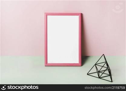 blank white frame with pink border against pink background