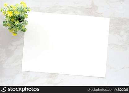 Blank white note paper on white marble background, flat lay, top view, template