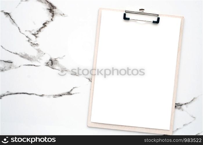 Blank white note papers and clip board on white marble background, copy space for art design background