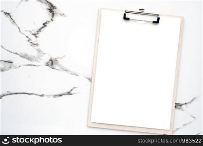 Blank white note papers and clip board on white marble background, copy space for art design background