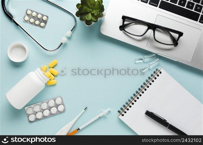 blank white paper with clipboard pen near stethoscope blue background