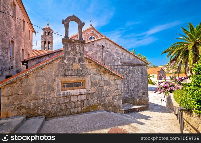 Blato on Korcula island historic stone square and church view, southern Dalmatia region of Croatia