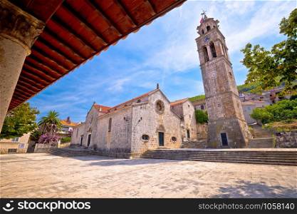 Blato on Korcula island historic stone square town lodge and church view, southern Dalmatia region of Croatia