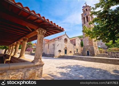Blato on Korcula island historic stone square town lodge and church view, southern Dalmatia region of Croatia