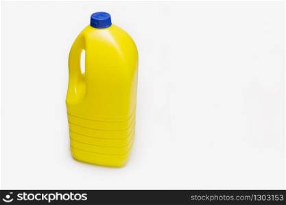 Bleach bottle isolated. Yellow Plastic container. Copy space