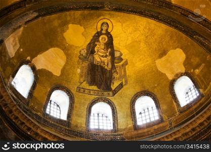 Blessed Virgin Mary with baby Jesus Byzantine mosaic art on the Hagia Sophia apse in Istanbul, Turkey