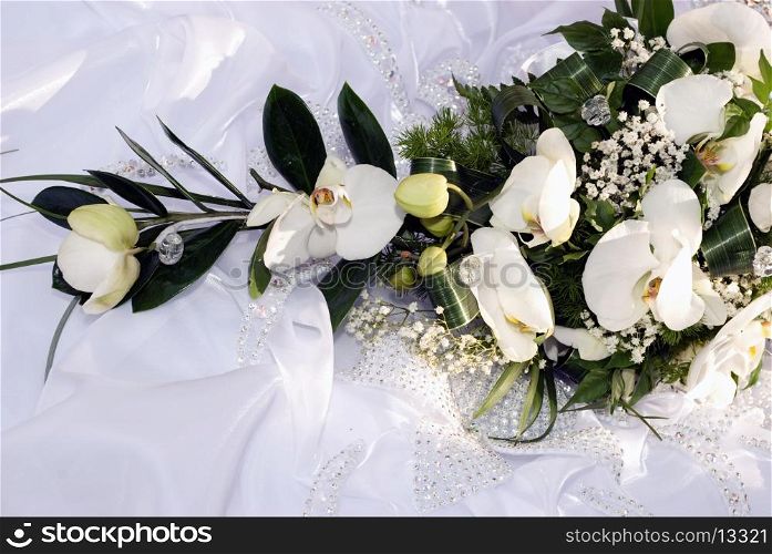Blide hold the bouquet from orchids