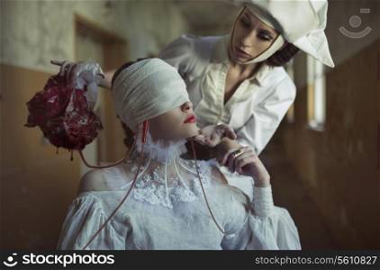 Blind patient and nurse in the old creepy hospital