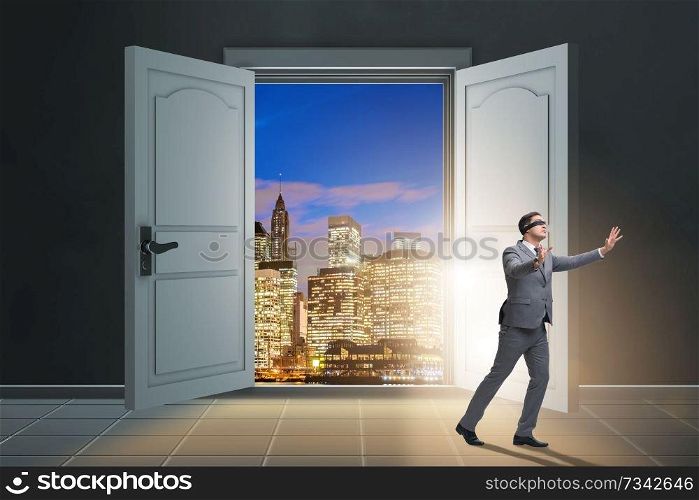 Blindfold businessman in uncertainty concept