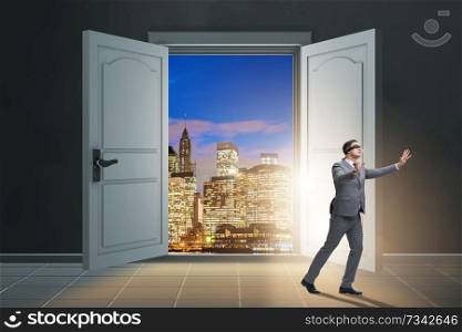 Blindfold businessman in uncertainty concept