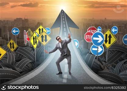 Blindfold businessman on the road unsure