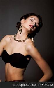 Bliss. Sultry Graceful Beauty in Black Bra with Golden Jewelery - Necklace and Earrings