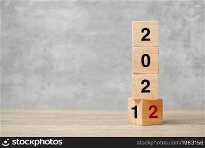 block flipping 2021 to 2022 text on table. Resolution, strategy, plan, goal, motivation, reboot, business and New Year holiday concepts