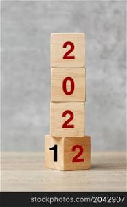 block flipping 2021 to 2022 text on table. Resolution, strategy, plan, goal, motivation, reboot, business and New Year holiday concepts
