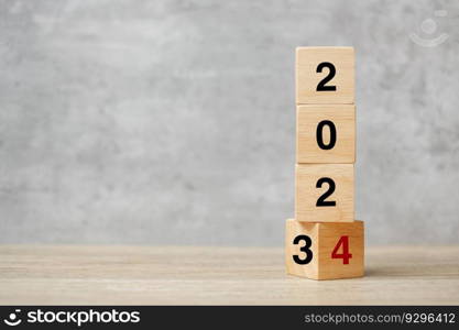 block flipping 2023 to 2024 text on table. Resolution, strategy, plan, goal, motivation, reboot, business and New Year holiday concepts