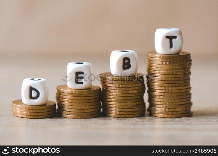 Block word debt on pile of coins, Payment of taxes and of debt to the state, Concept of financial crisis and problems risk management debt exemption loan