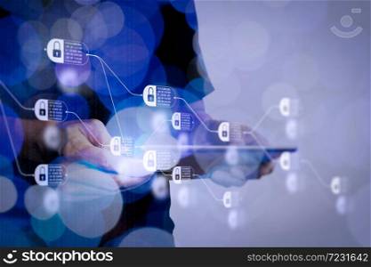 Blockchain technology concept with diagram of chain and encrypted blocks. Double exposure of businessman hand using Tablet computer with colour cloud concept