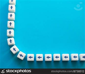 Blocks with chain arrows on a blue background. Moving forward, step by step. New opportunities. Strategic planning. Motivation, self-development. Set course, make your way. Copy space, place for text