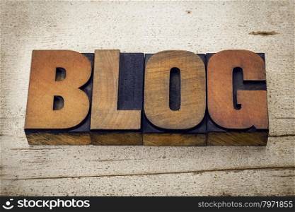 blog - a word in vintage letterpress wood type on a grunge white painted barn wood background