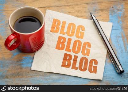 blog, blog, blog - blogging concept on a napkin with cup of espresso coffee