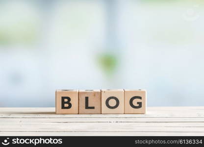 Blog sign on a wooden table with cubes