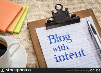 blog with intent advice or reminder on a clipboard with a cup of coffee