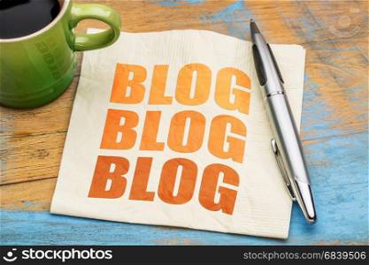 blog word abstract - blogging concept on a napkin with cup of espresso coffee
