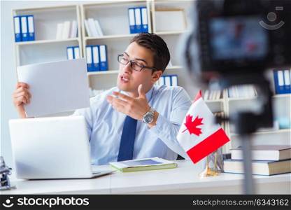 Blogger doing webcast on canadian immigration to Canada. The blogger doing webcast on canadian immigration to canada
