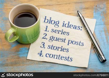 Blogging ideas list (series, guest post, stories, contests) - handwriting on a napkin with a cup of espresso coffee