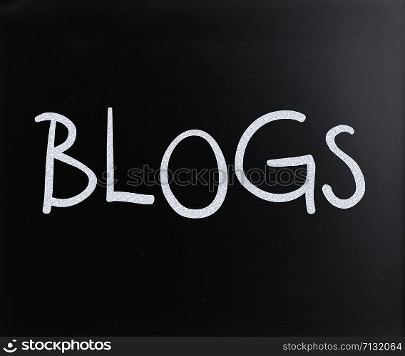 ""Blogs" handwritten with white chalk on a blackboard"