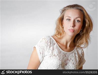 blond 20s female studio shot, head and shoulders image