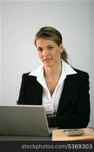Blond accountant sat at desk
