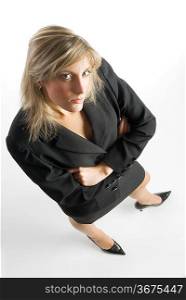 blond and attractive young woman in formal black suit making faces