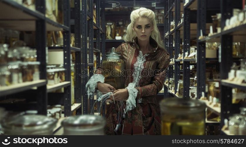 Blond attractive lady in the retro laboratory