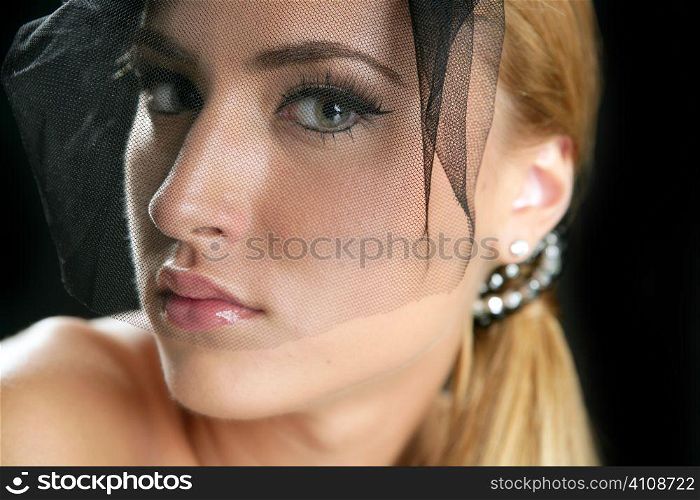 Blond beautiful fashion model woman tulle veil portrait