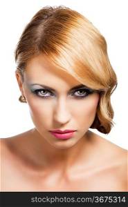 blond beautiful woman with strong make up and an old fashion hair stylish in beauty portrait close up, she is in front of the camera, looks in to the lens with actractive expression