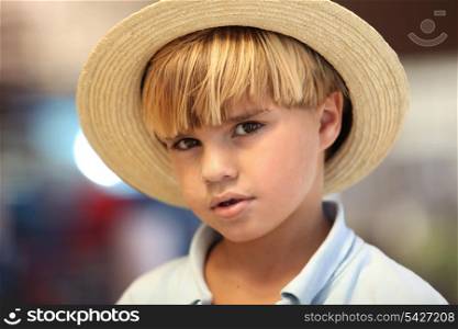 Blond boy with straw hat