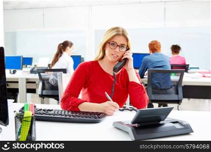 Blond business woman in call center working office with telephone call at desk