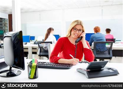 Blond business woman in call center working office with telephone call at desk