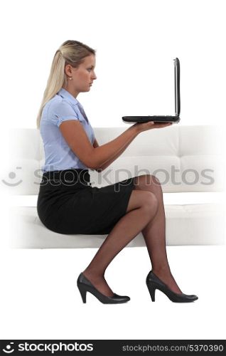 Blond businesswoman chatting via the Internet