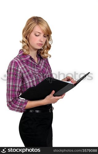Blond businesswoman checking her schedule