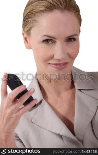 Blond businesswoman holding phone
