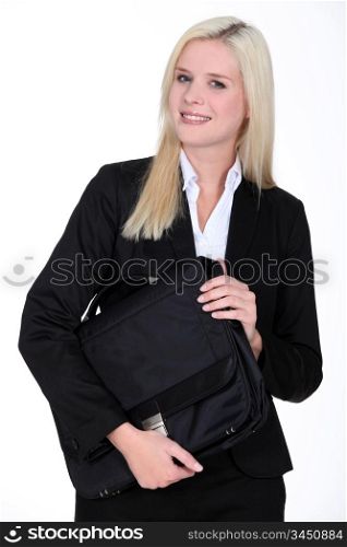 Blond businesswoman holding satchel