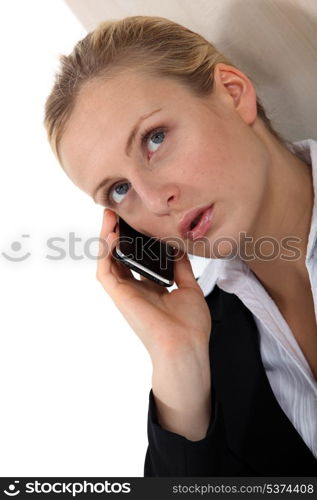 Blond businesswoman making call