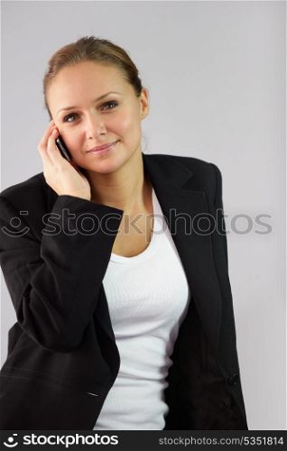 Blond businesswoman making telephone call