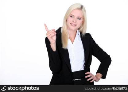 Blond businesswoman pointing