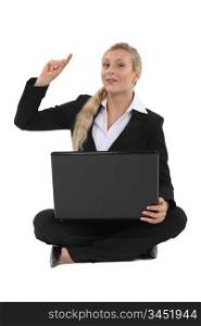 Blond businesswoman raising hand with question