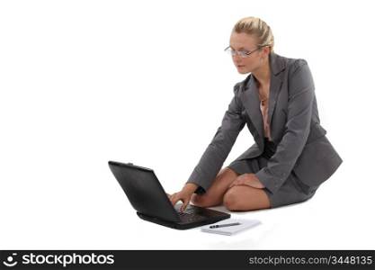 Blond businesswoman sat on the floor